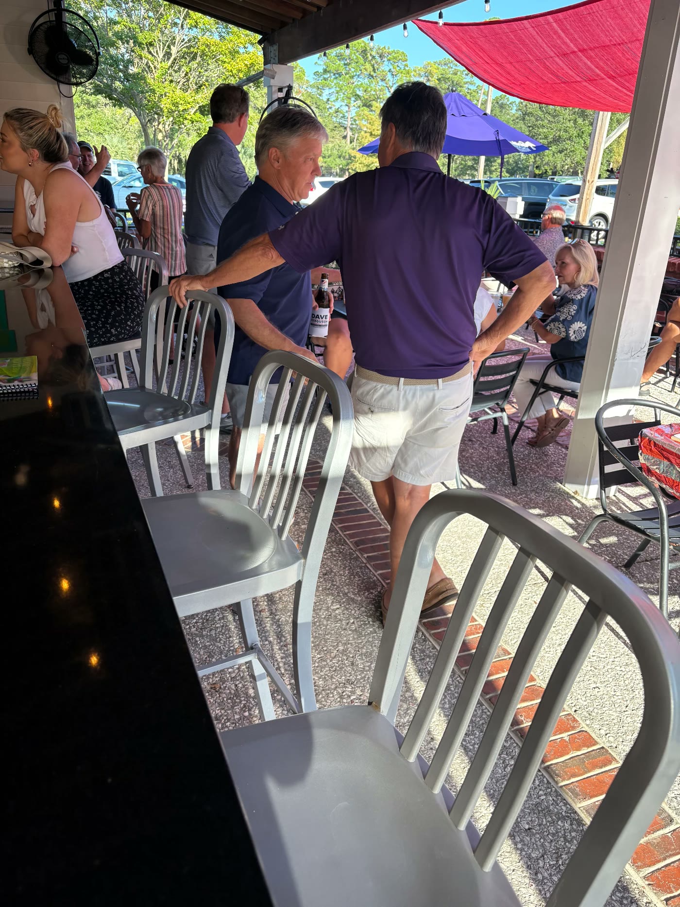 Dave Ferguson chatting with a resident at the bar